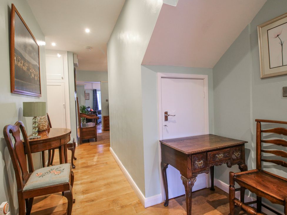 A hallway with a table and chairs at The Rumbles