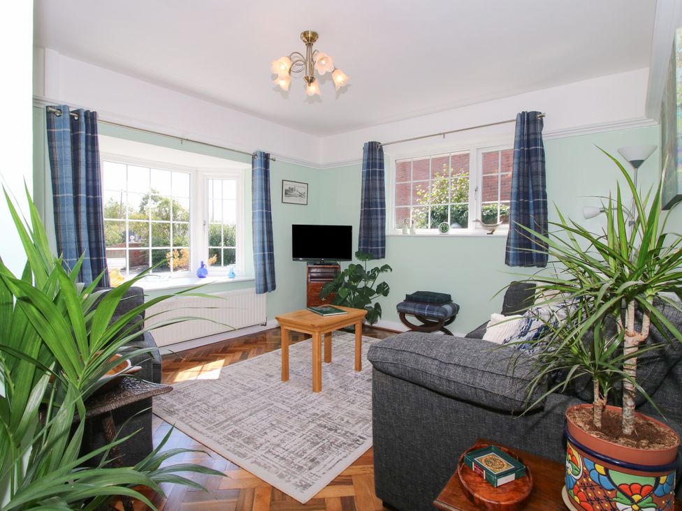 A living room with a sofa and coffee table at The Rumbles in Ludlow