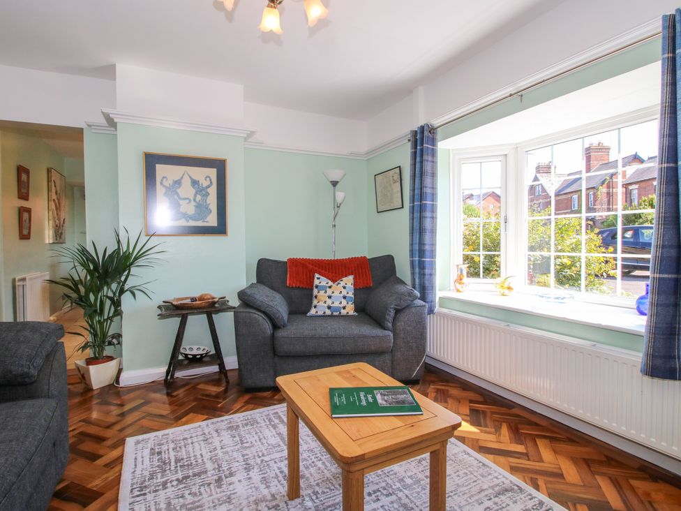 A living room with a sofa and coffee table at The Rumbles in Ludlow