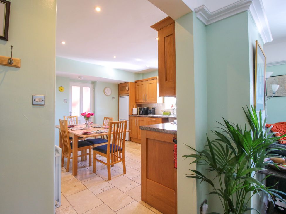 A kitchen with a dining table and chairs at The Rumbles in Ludlow