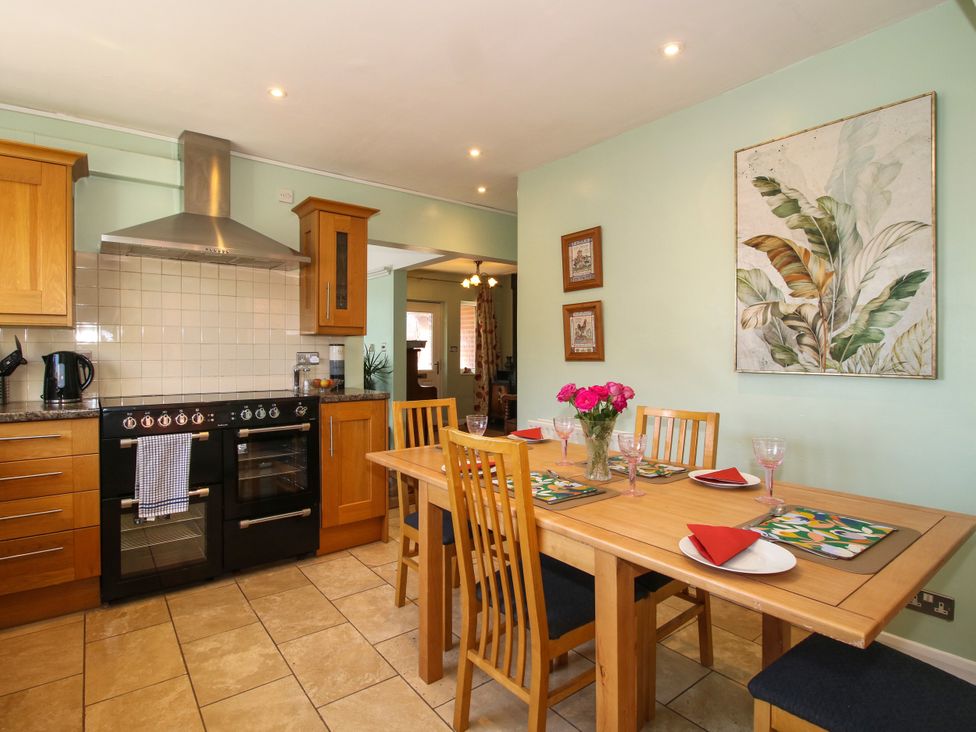 A kitchen with a dining table and chairs at The Rumbles in Ludlow
