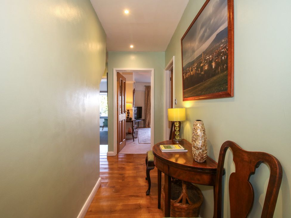 A hallway with a table and lamp at The Rumbles in Ludlow