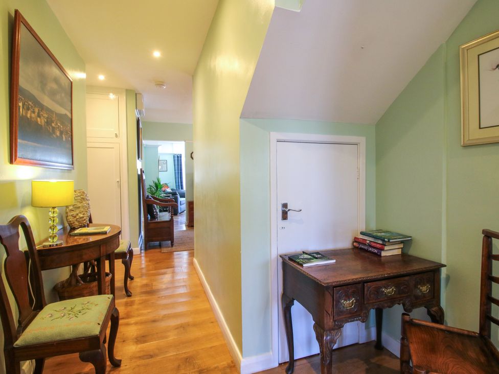 A hallway with a wooden table and chairs at The Rumbles in Ludlow