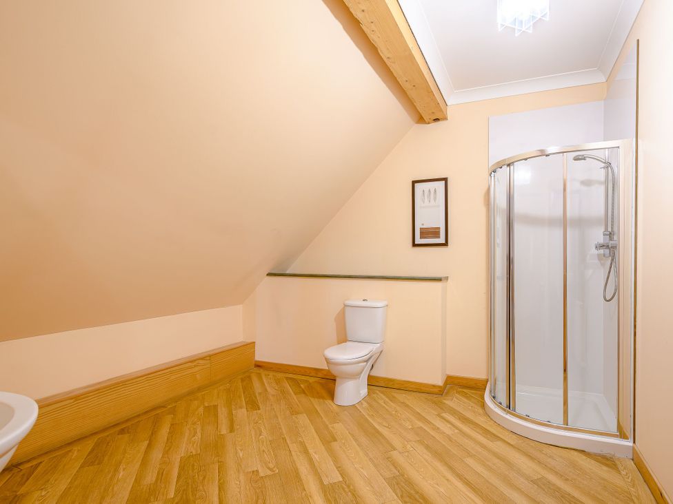 A bathroom with a shower and toilet at Foresters Spa Plus in Dundee