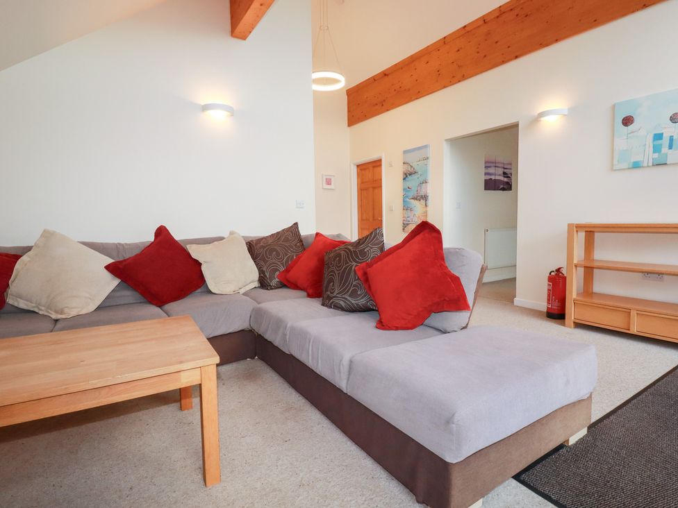 A living room with a sofa and coffee table at 65 Benasa Lodge in Winnard's Perch near St Columb Major