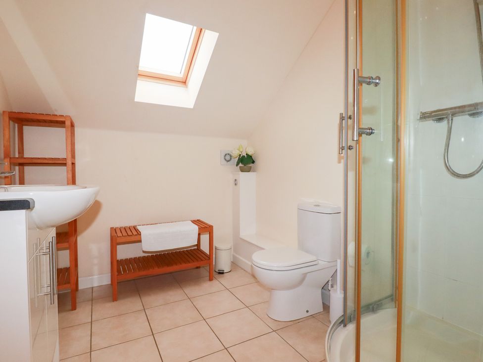 A bathroom with a shower, sink, and toilet at 65 Benasa Lodge in Winnard's Perch near St Columb Major