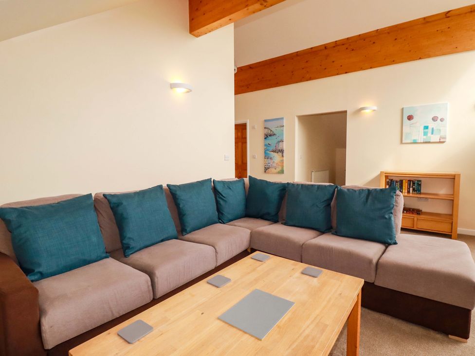 A living room with a sofa and a coffee table at 65 Benasa Lodge in Winnard's Perch near St Columb Major