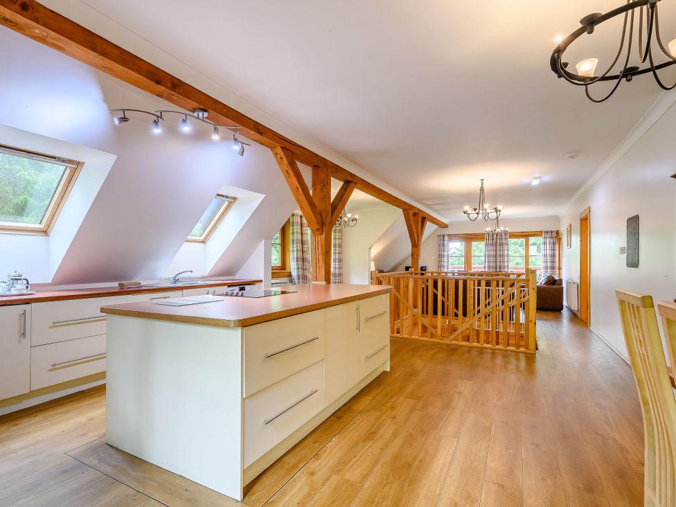 A kitchen with island and windows at Eagle Spa Plus in Dundee