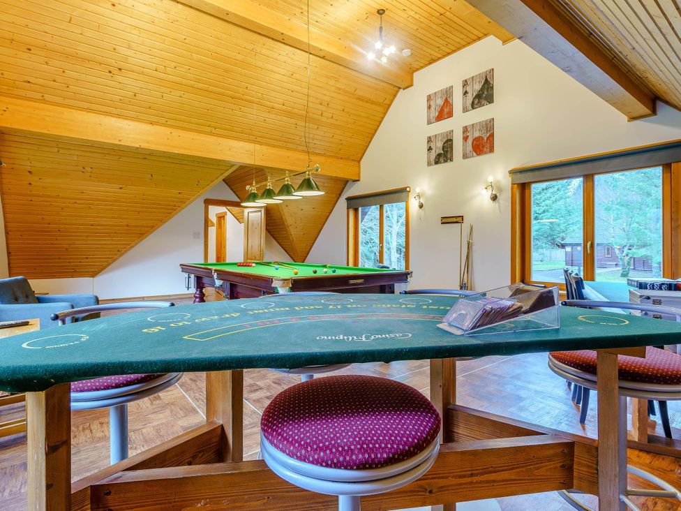 A game room with pool and poker tables at The Braveheart in Dundee