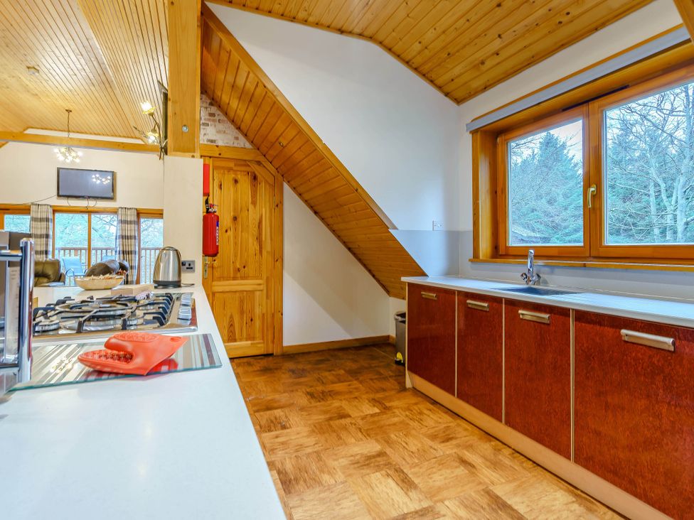 A kitchen with cabinets and a sink at The Braveheart in Dundee