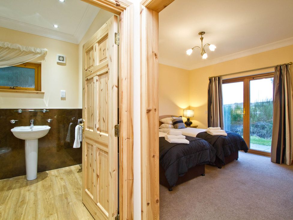 A bedroom with two beds and a window at The Braveheart in Dundee