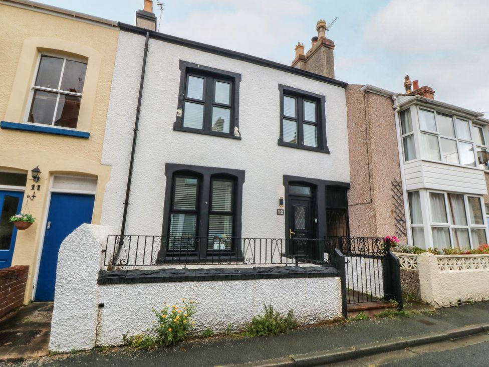 A house with black door and windows at Mona Lodge in Llandudno