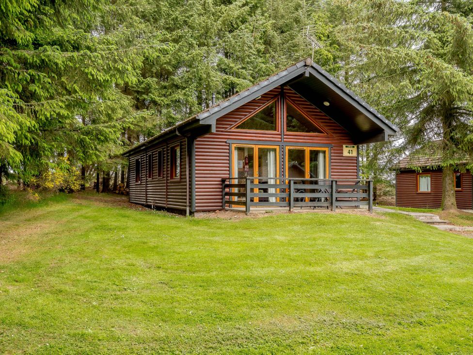 A cabin surrounded by trees at Barnard Spa (Pet) Dundee
