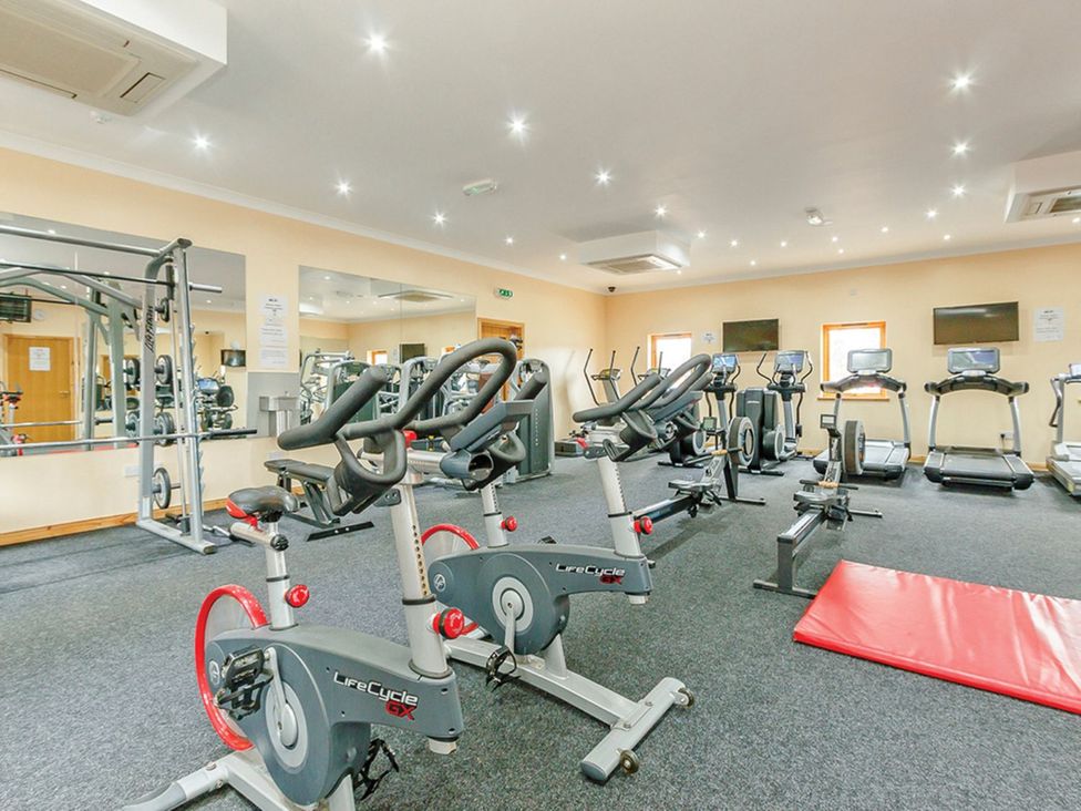 A gym with exercise bikes and treadmills at Osprey Lodge Dundee