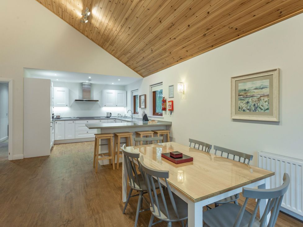 A kitchen with dining table and chairs at Galbraith Premier Spa in Dundee