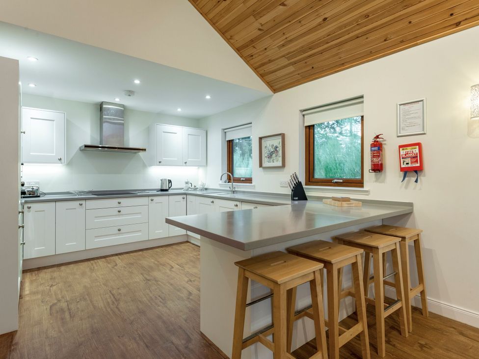 A kitchen with cabinets and counter space at Galbraith Premier Spa (Pet) in Dundee