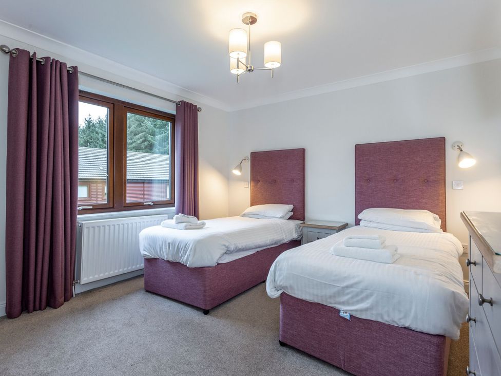 A bedroom with two single beds at Galbraith Premier Spa (Pet) in Dundee
