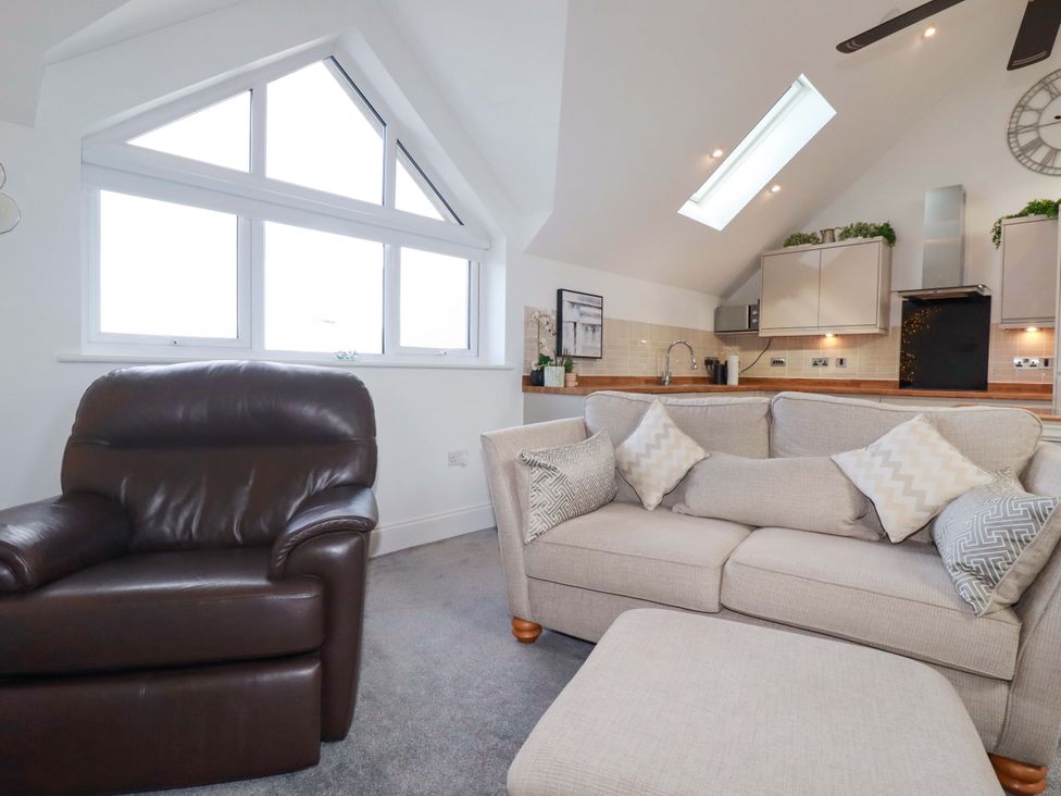 A living room with a sofa and armchair at 33 Fordh Tobmen in St. Agnes