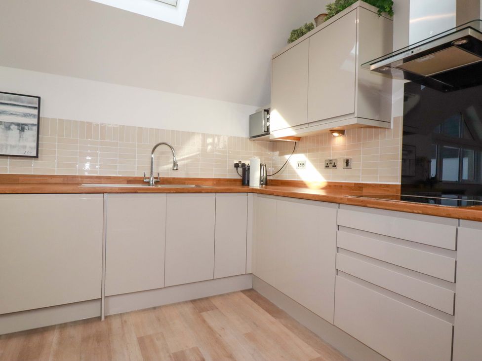A kitchen with cabinets and a sink at 33 Fordh Tobmen St. Agnes