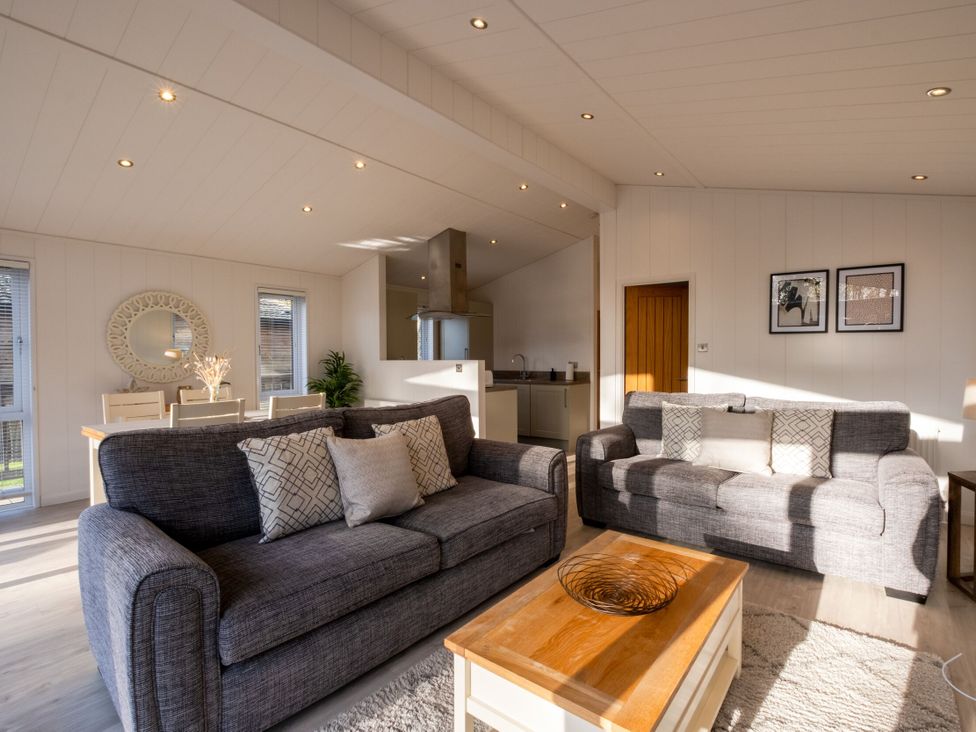 A living room with sofas and a coffee table at Belfry in Waltham