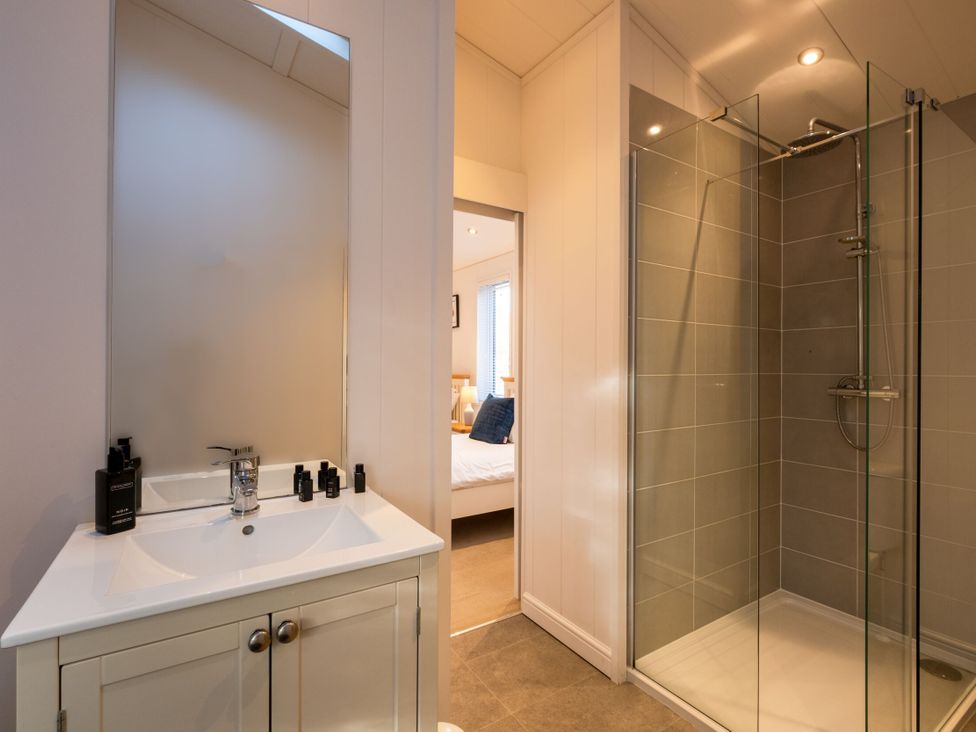 A bathroom with a sink and shower at Belfry in Waltham