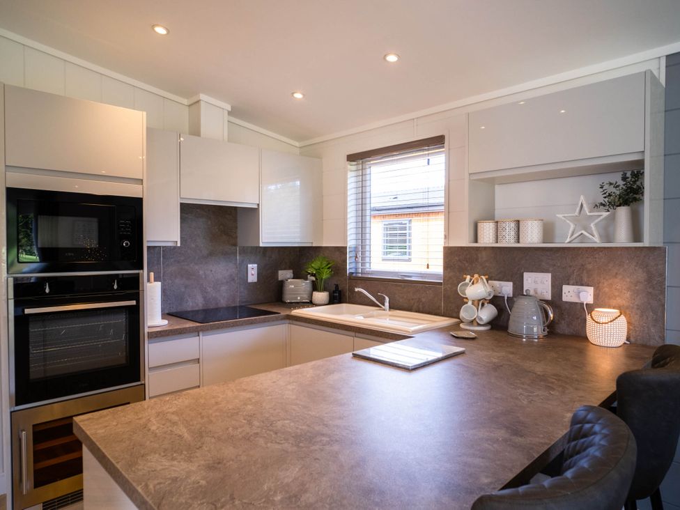 A kitchen with modern appliances and a sink at Imperial View in Waltham
