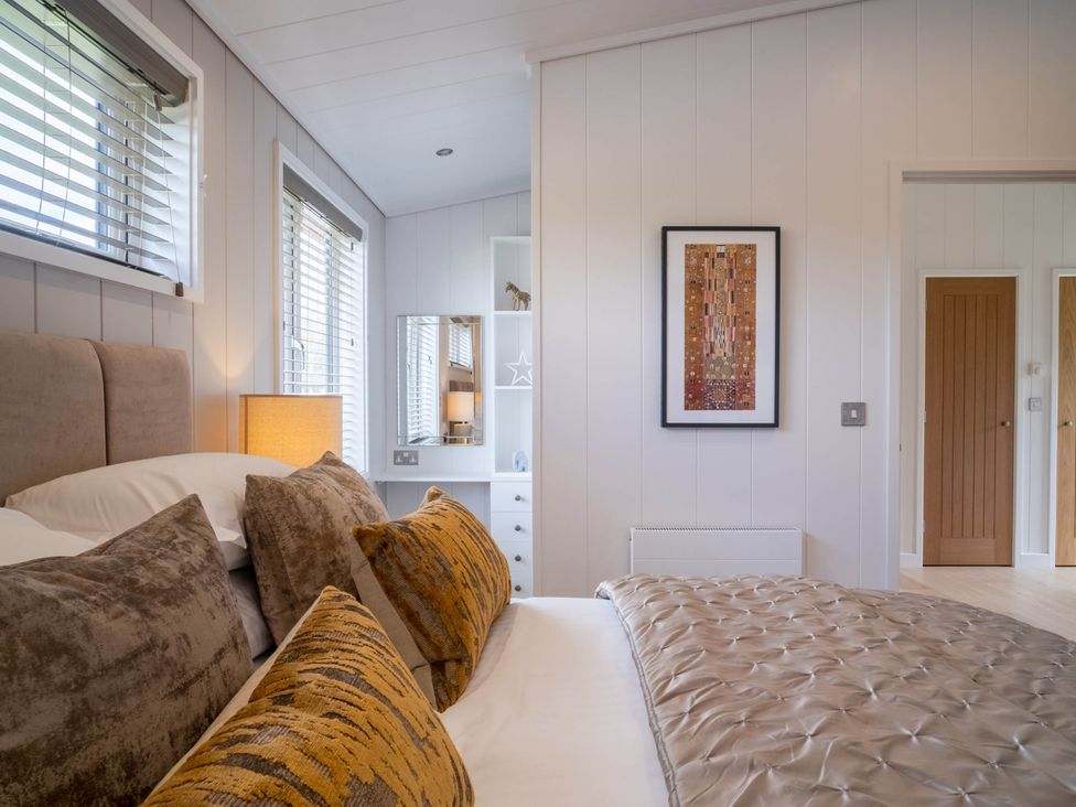 A bedroom with a bed and pillows at The Luxury Escape in Waltham