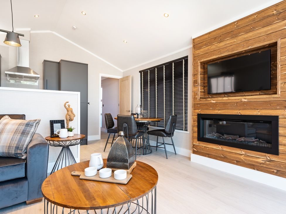 A living room with a sofa and television at Shangri-La in Waltham