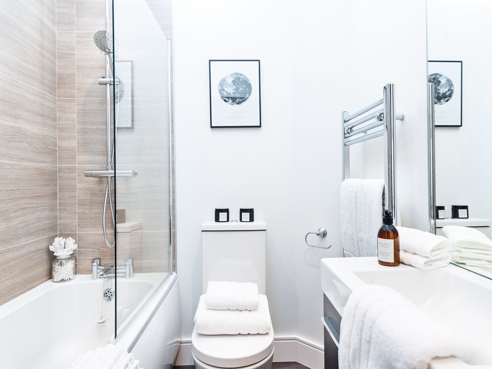 A bathroom with a bathtub, shower, and toilet at Shangri-La in Waltham