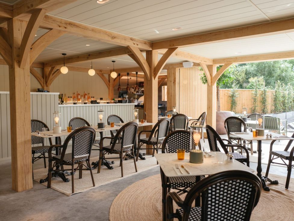 A dining room with tables and chairs at Shangri-La in Waltham