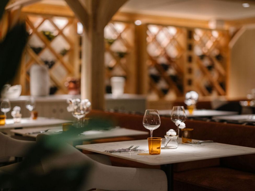 A dining room with tables and wine glasses at Shangri-La in Waltham