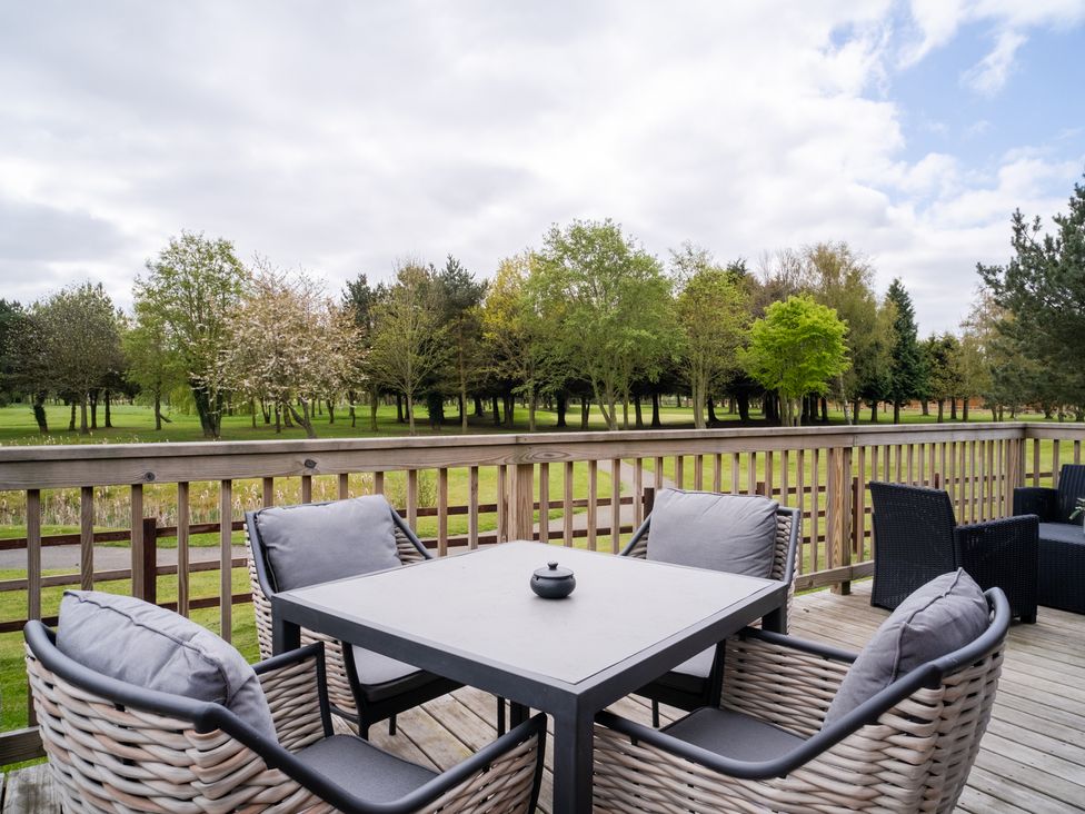 An outdoor seating area with a table and chairs at The View in Waltham