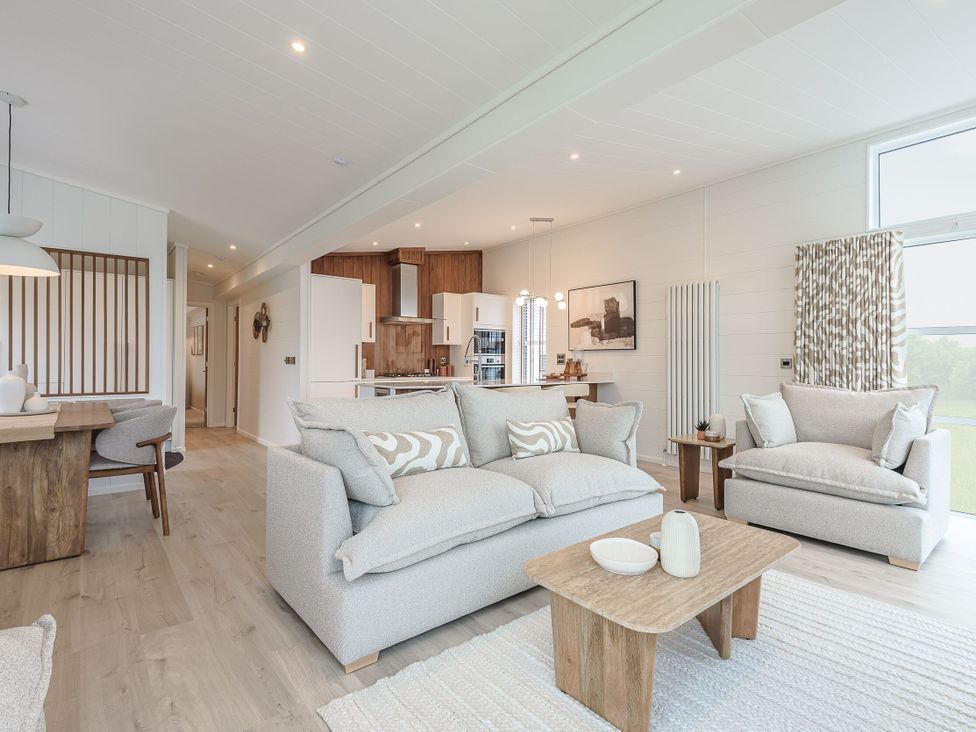 A living room with a sofa and coffee table at Exclusive Aura Spa in Waltham