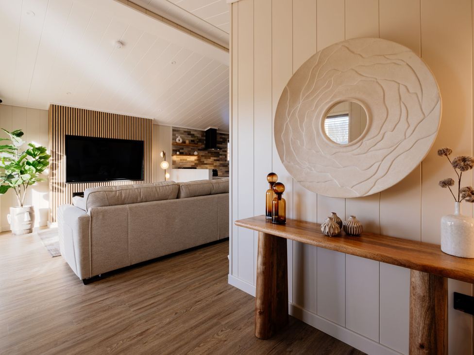 A living room with a sofa and television at Luxury Boutique Retreat Pet in Waltham