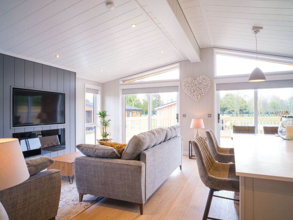 A living room with a sofa and coffee table at Marrakech in Waltham
