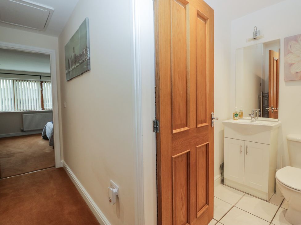 A bathroom with sink and toilet at 6 Swan House in Tewitfield