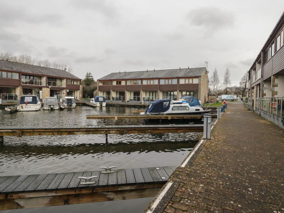 A marina with boats and buildings at 6 Swan House Tewitfield