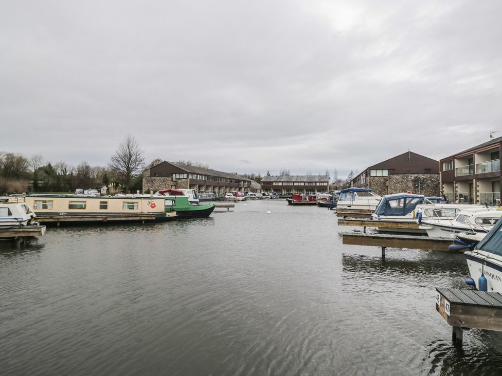 A marina with boats and houses at 6 Swan House in Tewitfield