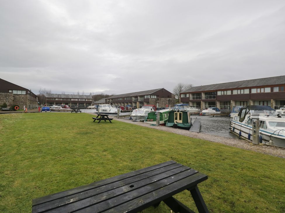 An outdoor area with boats by the water at 6 Swan House Tewitfield