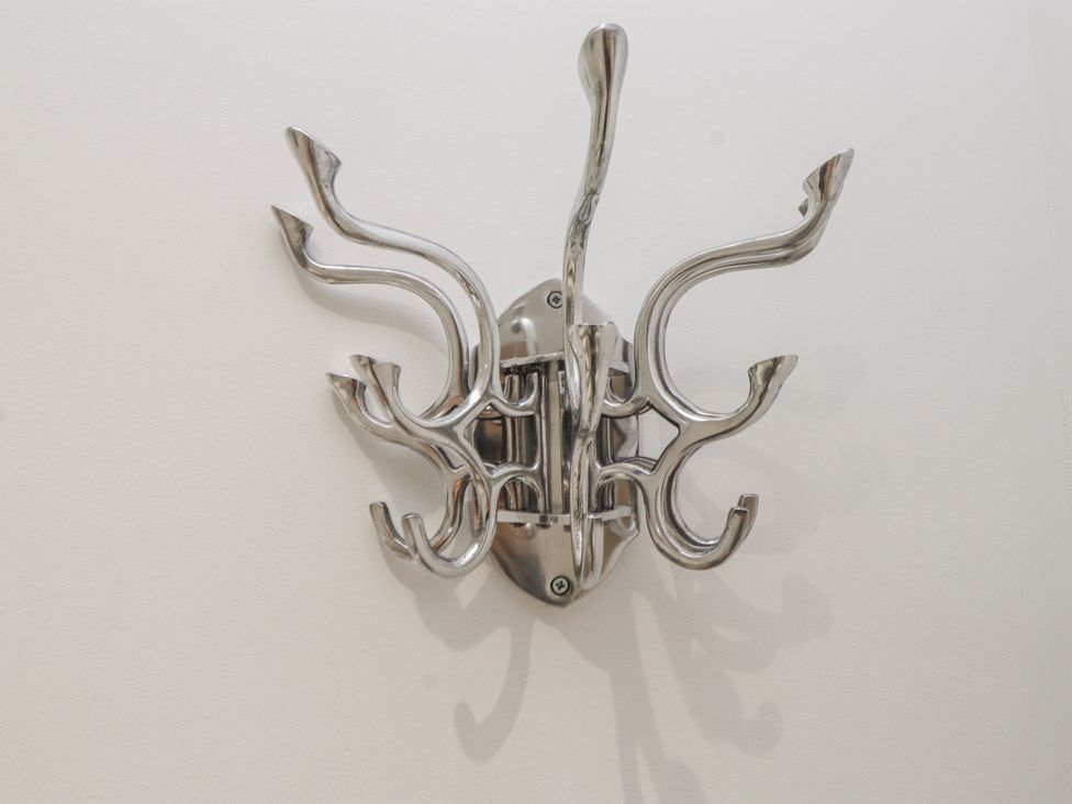 A coat hook mounted on a wall at Ty'n Lon in Pwllheli