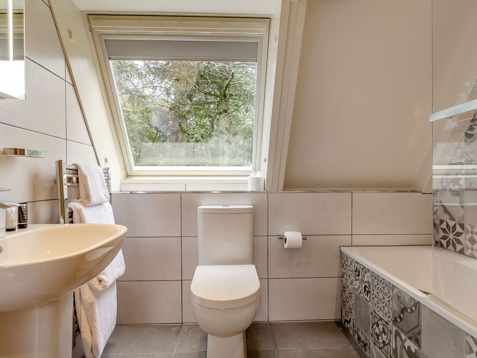 A bathroom with a toilet and sink at St Ives Studio Spa in Praze-An-Beeble