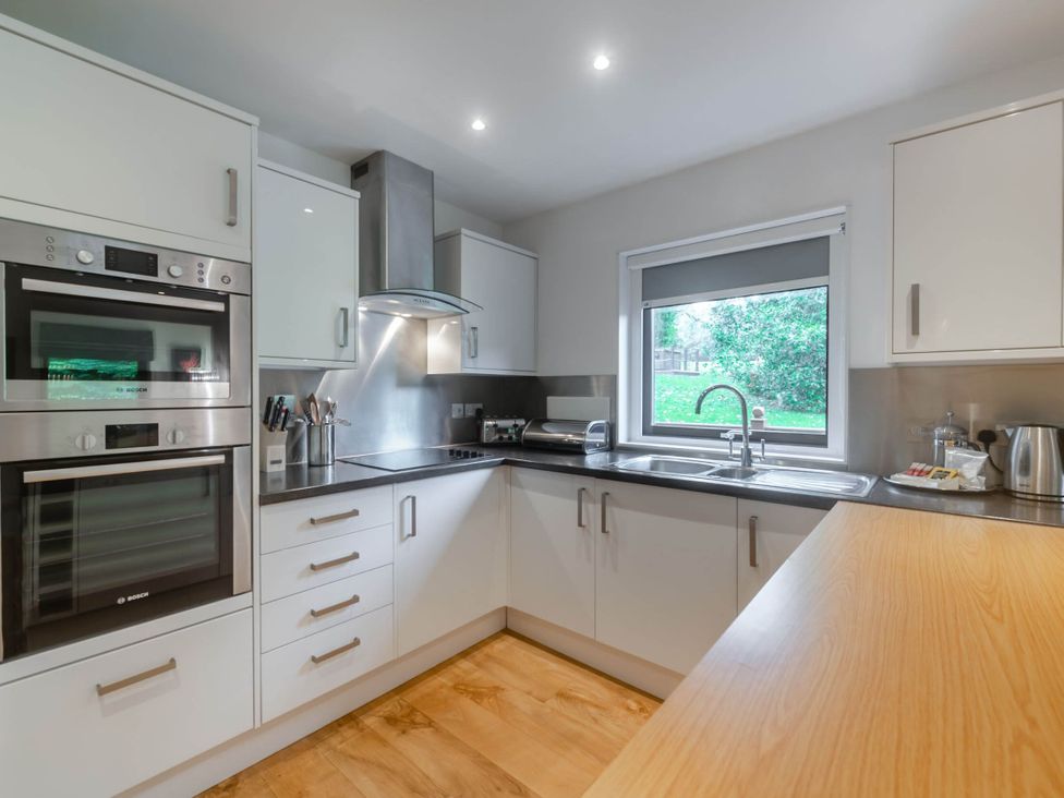A kitchen with a sink and appliances at Cornwall Lodge Spa in Praze-An-Beeble