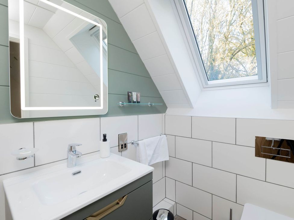 A bathroom with a sink and toilet at Lowarth Lodge Spa Pet Praze-An-Beeble