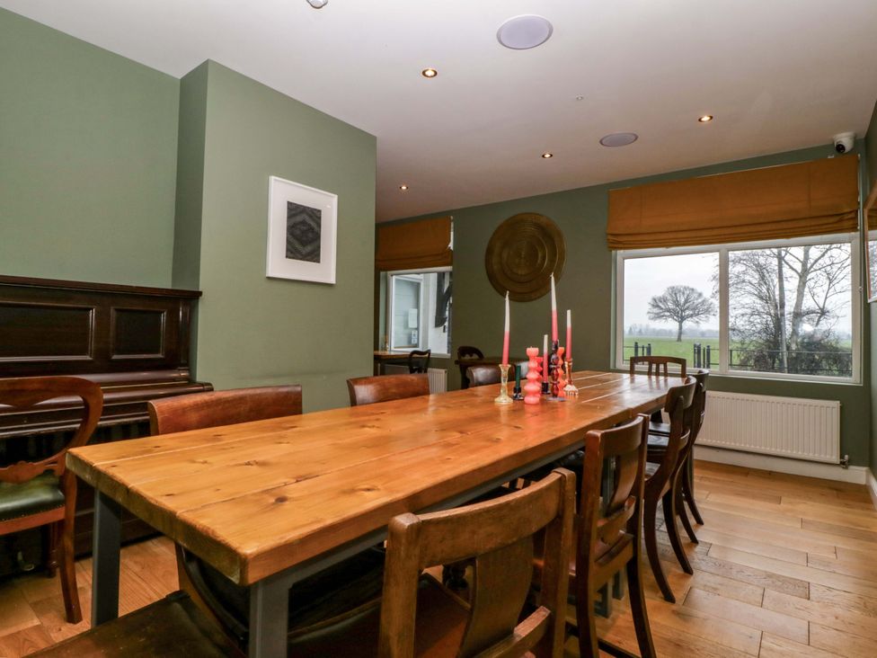 A dining room with a table and chairs at The Swan in 