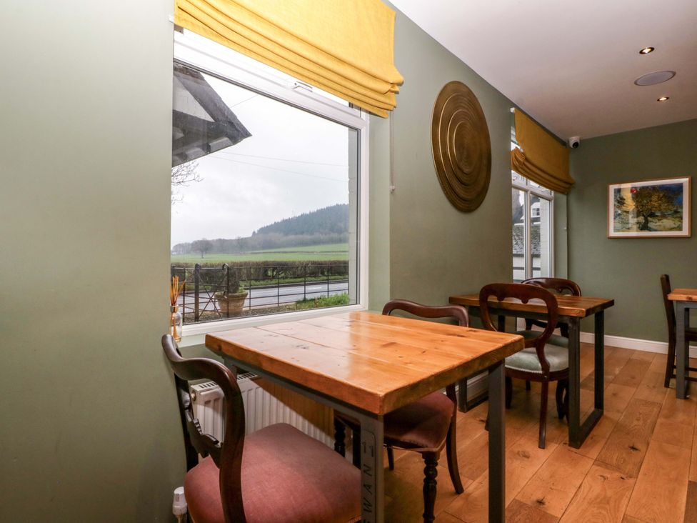 A dining room with tables and chairs at The Swan