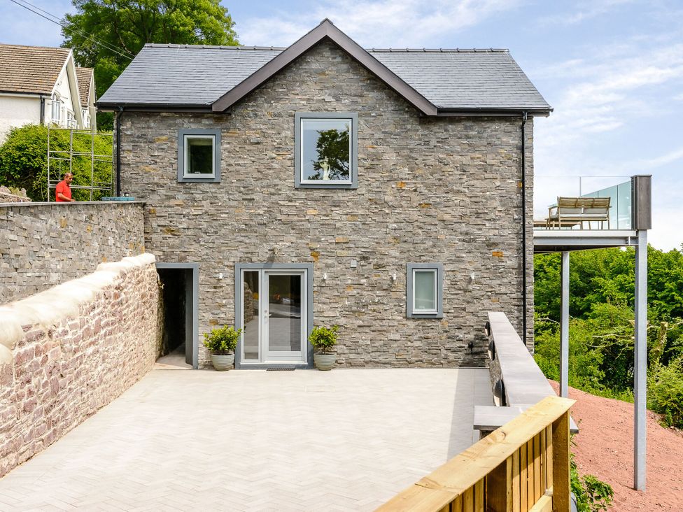 A house with a deck and garden area at The View in Laugharne