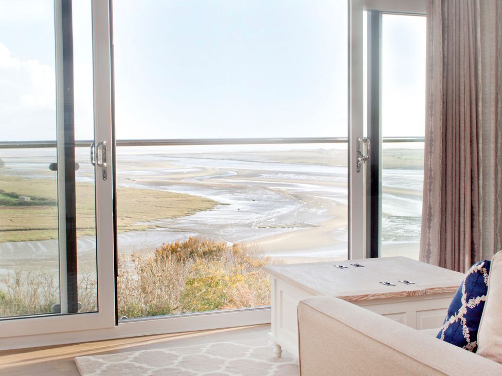 A living room with a view of the landscape at Milk Wood 3 in Laugharne