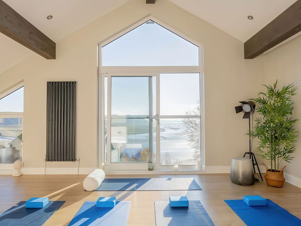A yoga studio with mats and blocks at Epic Spa (Pet) in Laugharne