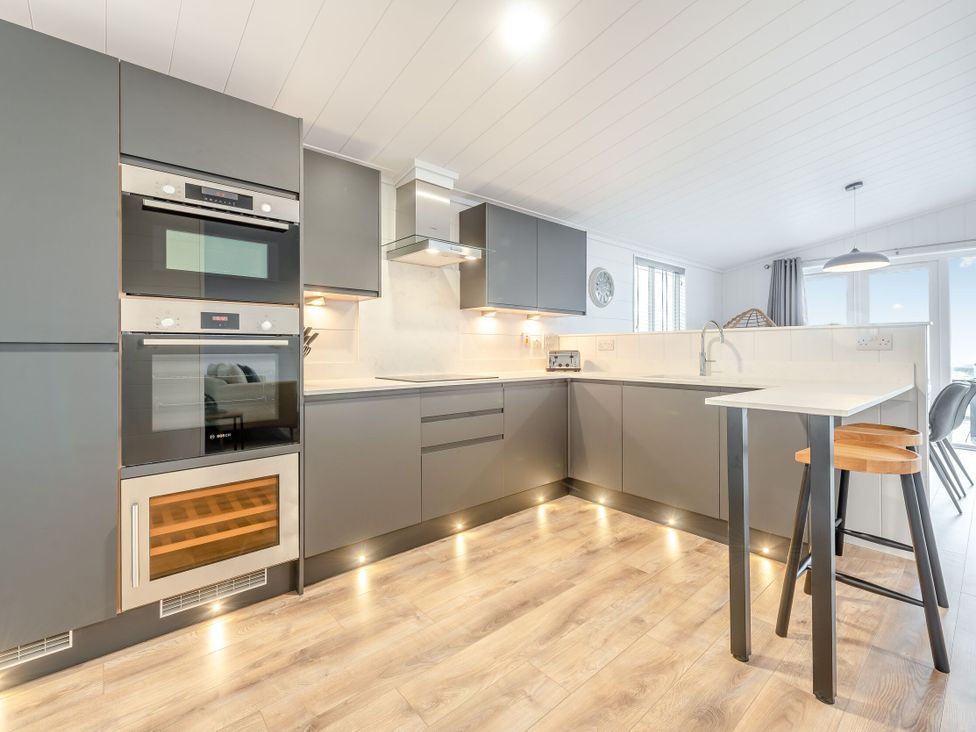 A kitchen with modern appliances and a countertop at Sonnet 3 Laugharne