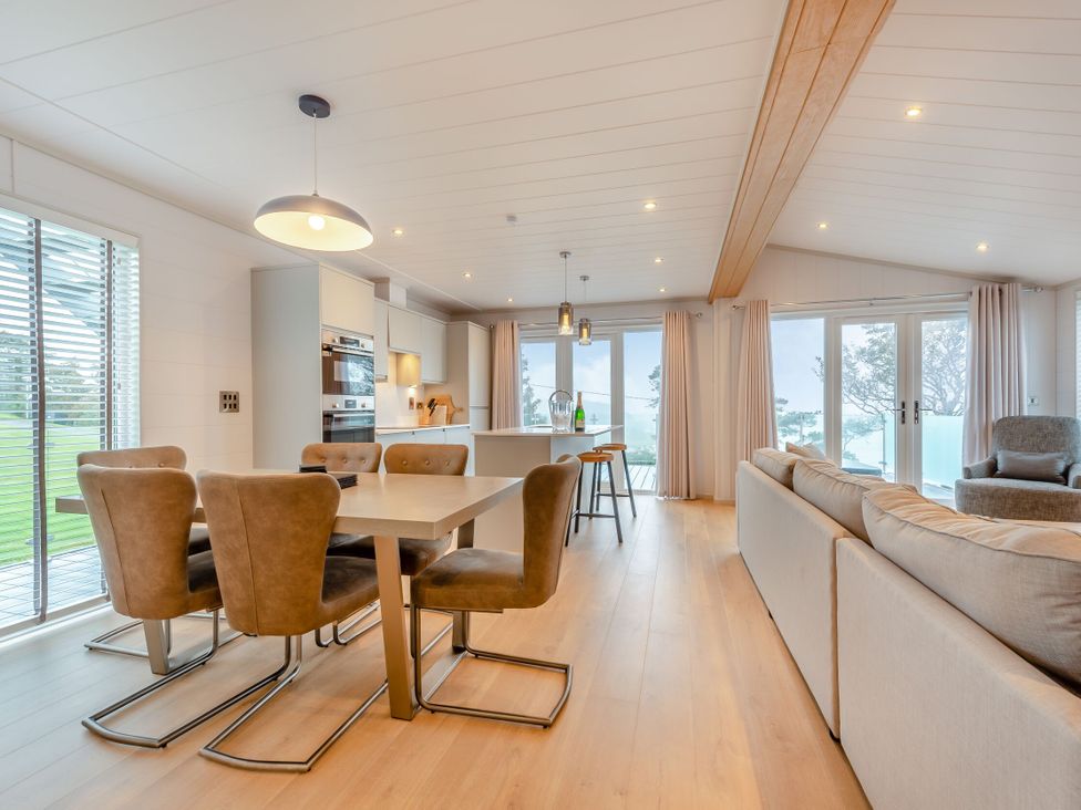 A dining area with table and chairs at Epic Spa (Roof Terrace) Laugharne